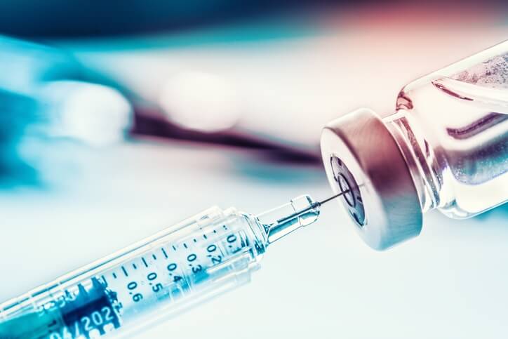 A syringe and vial of medicine